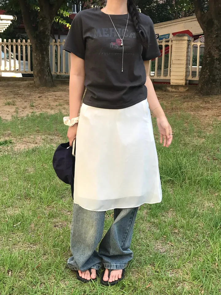 Wrap mini skirt over straight leg jeans